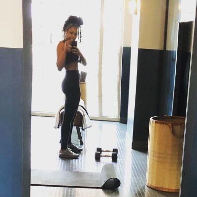 Jazz Raycole posing for a photo shoot after completing her daily workout